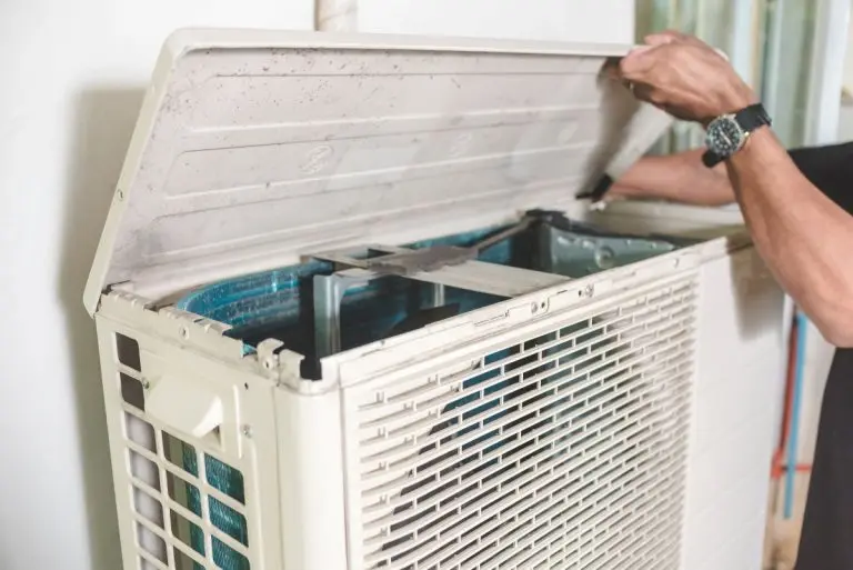 furnace and ac replacement cost hands doing ac maintenance
