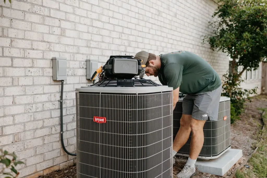ac capacitor replacement cost worker replacing unit
