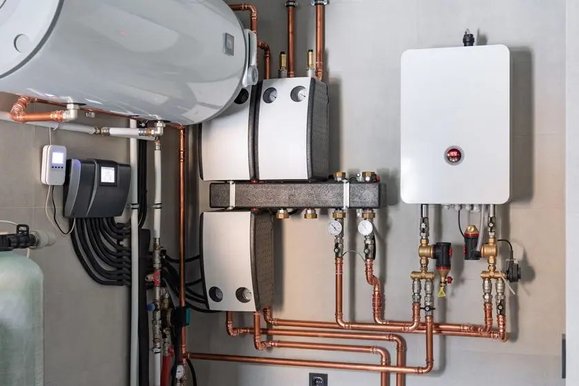 Heating system equipment in a boiler room of modern private house.