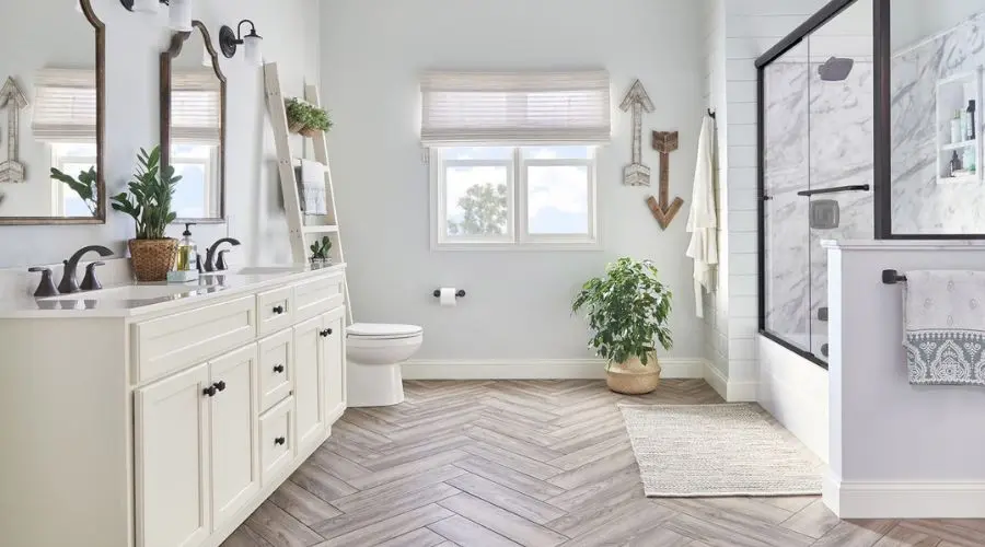 Modern bathroom with dual sinks, shower, and decorative shelving, showcasing optimal plumbing design by Scott Plumbing.