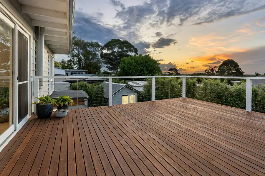 Brown decking boards installed beside a home