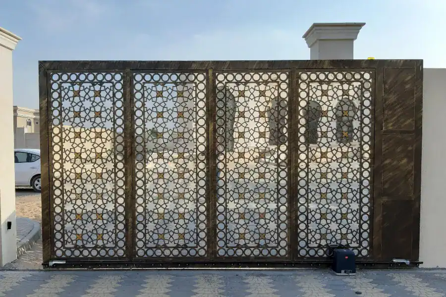 Decorative automatic sliding gate at a residential entrance