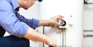 Plumber installing water heater, JD Precision Plumbing & Air in Spring, TX.