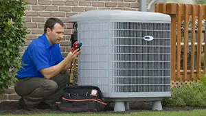 JD Precision Plumbing & Air technician performing drain cleaning service in a bathroom.