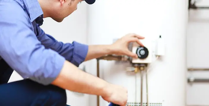 Plumber installing water heater, JD Precision Plumbing & Air in Spring, TX.
