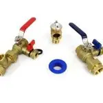 Brass plumbing valves with red and blue handles, including a valve and a blue washer, representing essential components for water heater maintenance.