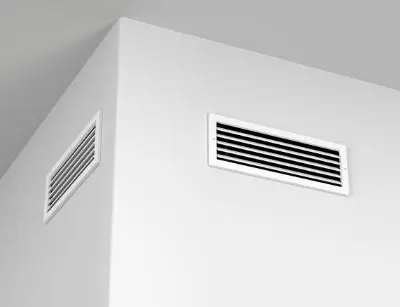 Air vents in a modern home setting, highlighting the importance of proper airflow for HVAC efficiency and maintenance.