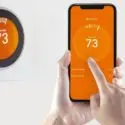 Smart thermostat and mobile app interface showing 73&deg;F, highlighting Jerry Brittingham A/C & Heat's HVAC solutions.