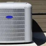 Air conditioning unit installed outside a home, highlighting HVAC maintenance and repair services relevant to energy efficiency and comfort.