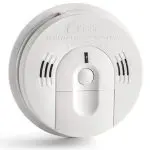 Round white smoke detector with buttons, indicators, and ventilation grills for home safety in HVAC systems.