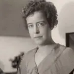 Young woman with curly hair in simple attire, reflecting on HVAC safety for homeowners by Jerry Brittingham A/C & Heat, Inc.