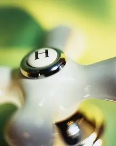 Falls Church Hot Water Heater Repair Hot water faucet handle with "H" indicator, representing water heater services, relevant to Falls Church plumbing repairs.
