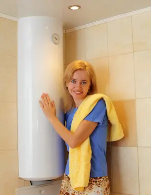 Importance of Water Heater Repair Arlington Plumber Woman embracing a water heater, highlighting the importance of water heaters in daily home life, with a focus on maintenance and repair.