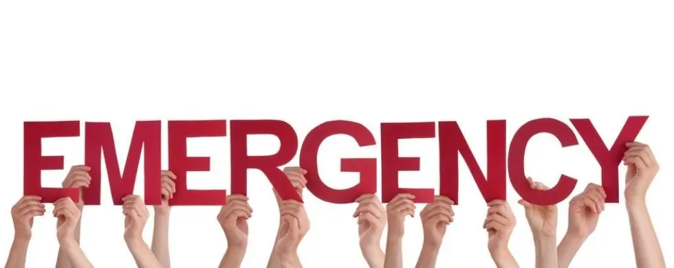 Hands holding large red letters spelling "EMERGENCY" for plumbing and home maintenance alerts by Lodder Brothers Limited.