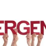 Hands holding red letters spelling 'EMERGENCY' for plumbing disaster alerts by Lodder Brothers Limited.