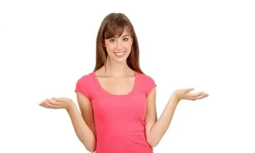 Young woman in a pink t-shirt smiling with hands raised, representing Charles Krull & Son, Inc. plumbing services.