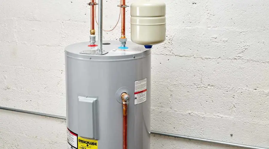 Water heater with copper pipes and pressure relief valve, showcasing plumbing maintenance importance for home heating systems.