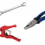 Image of professional plumbing tools: silver wrench, blue pliers, red clamps used by Charles Krull & Son, Inc.