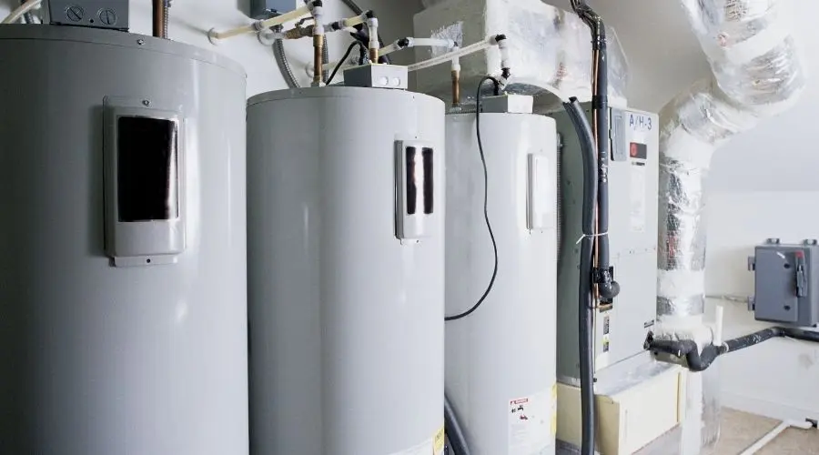 Water heaters and boiler system in a residential setting, illustrating plumbing and heating services relevant to homeowners.