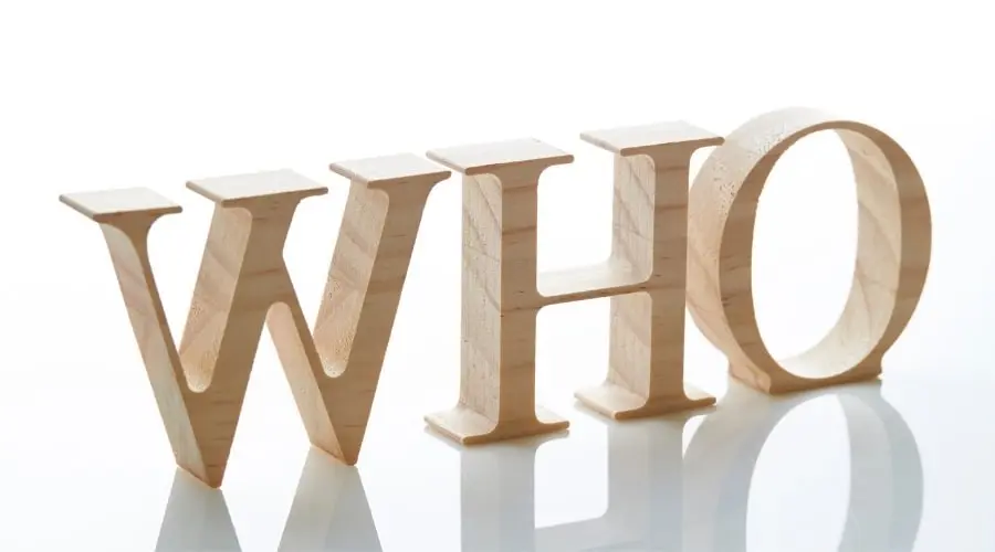 Wooden letters spelling "WHO" in natural finish, representing Charles Krull & Son, Inc. Plumbing & Heating services.