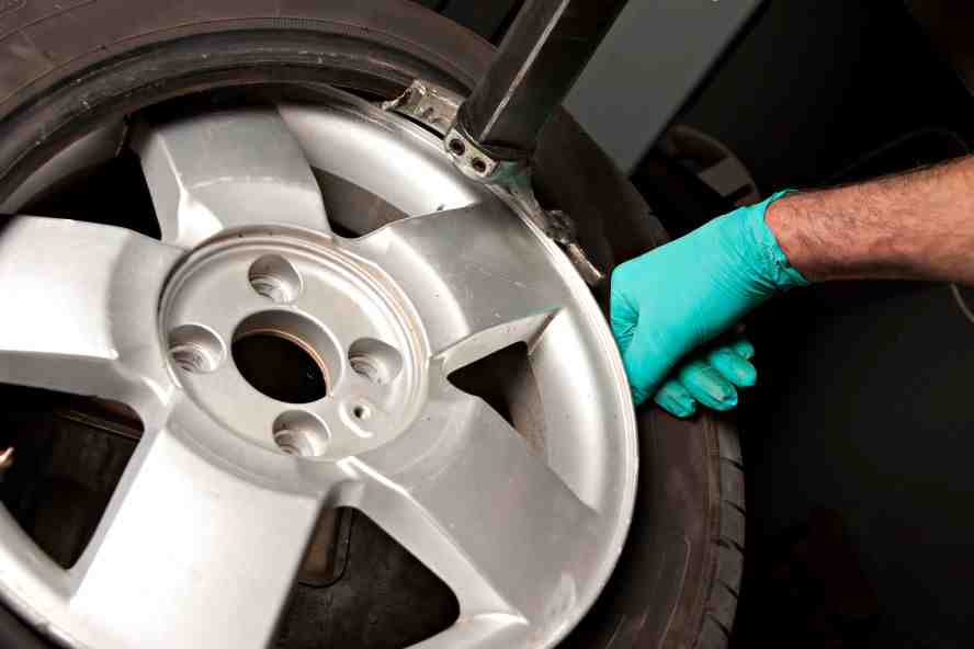 Damaged wheel undergoing repair at 850 Autos in Tallahassee