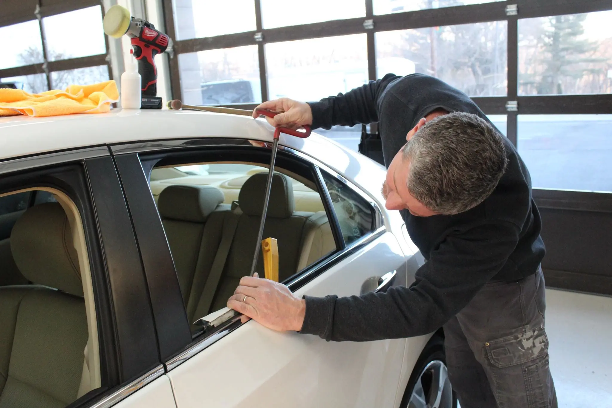 Auto body repair in progress at the 821 Collision shop in North Haledon, NJ