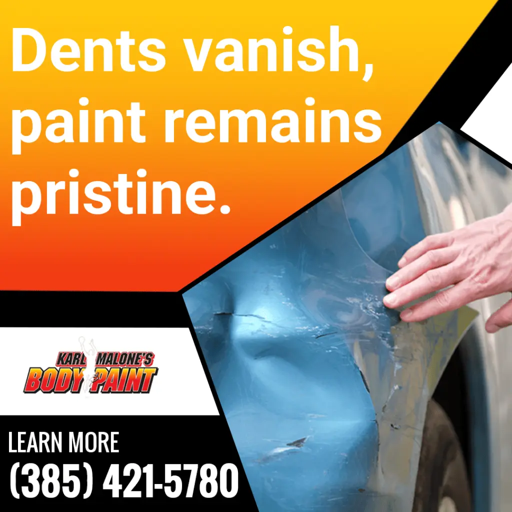 A technician pointing to a dented car door to show how Karl Malone's Body & Paint can make dents vanish while keeping the paint pristine.