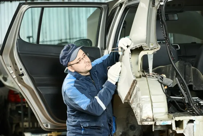 Male Auto body technician Repairing Body Car