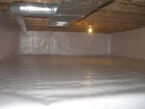 Crawl space encapsulation with a white vapor barrier covering the floor and foundation walls beneath exposed HVAC ductwork.