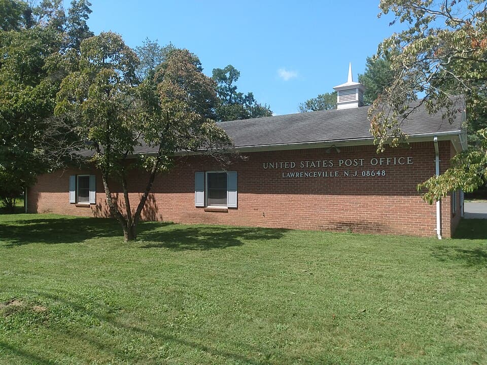 United States Post Office building in Lawrenceville, NJ, featuring brick exterior and green lawn, relevant to local community services.