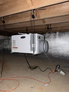 Aprilaire E100 dehumidifier installed during a crawl space encapsulation project in Mount Laurel, NJ to control moisture and improve indoor air quality.