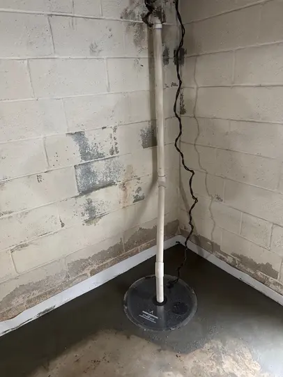 Sump pump installed in basement with interior drain tile system in Hastings-On-Hudson NY