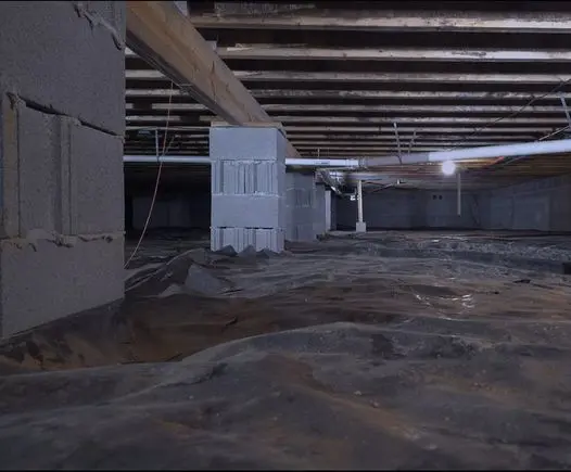 Encapsulated crawl space with moisture barrier beneath a home foundation