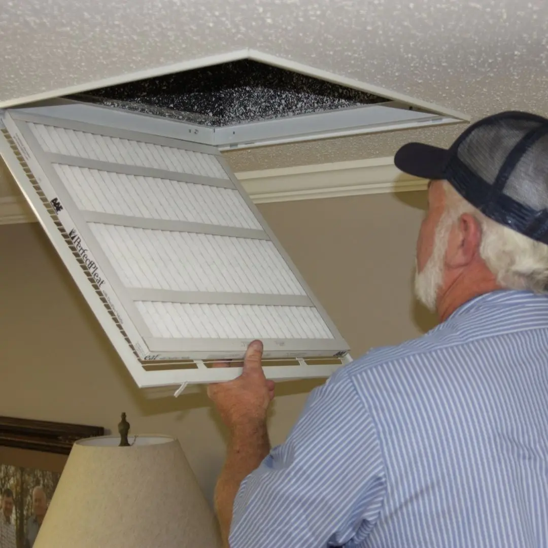Older-Male-Replacing-HVAC-Air-Filter