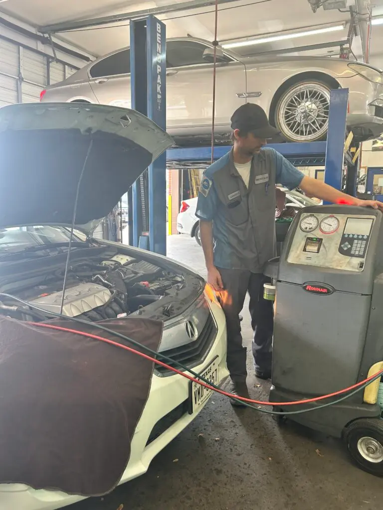 Technician performing air conditioning service in Houston summer