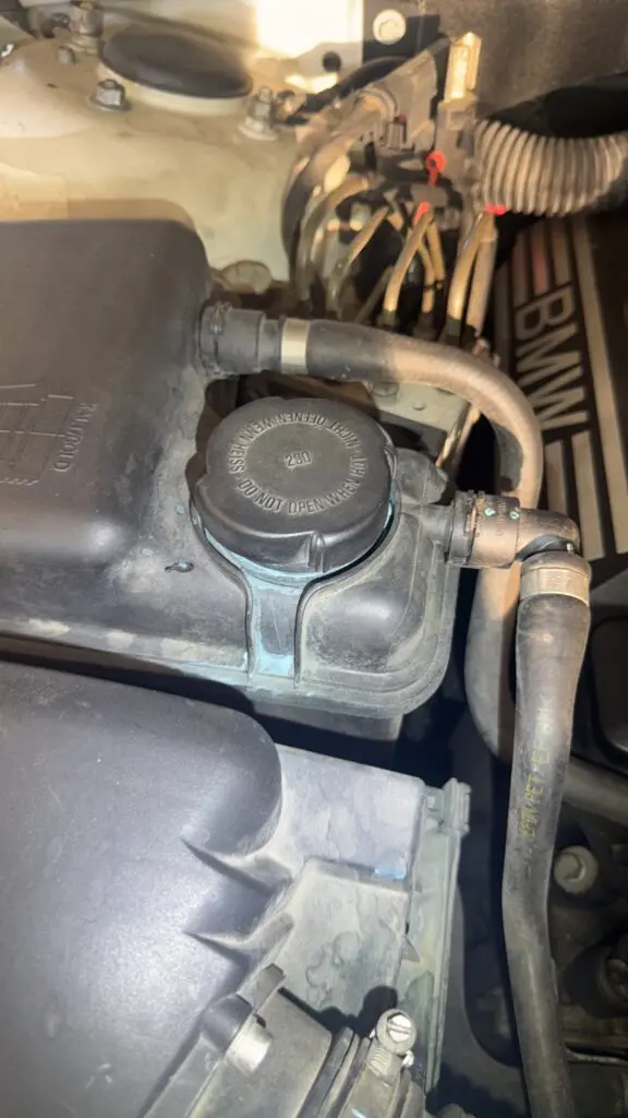 Dried coolant residue indicating a slow cooling system leak.