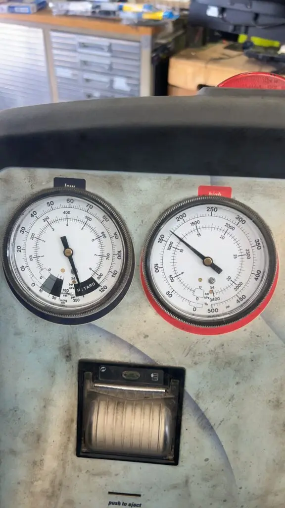 Checking A/C system pressures during an air conditioning inspection at Chimney Rock Car Care