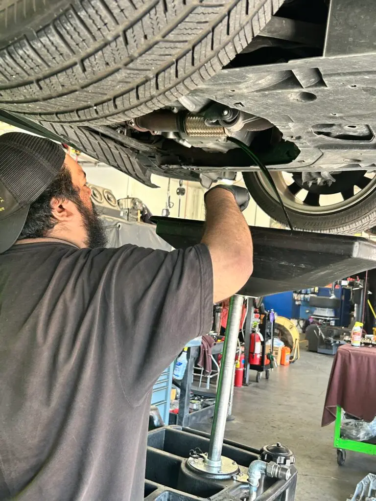 ASE certified technicians performing auto repair in Houston TX