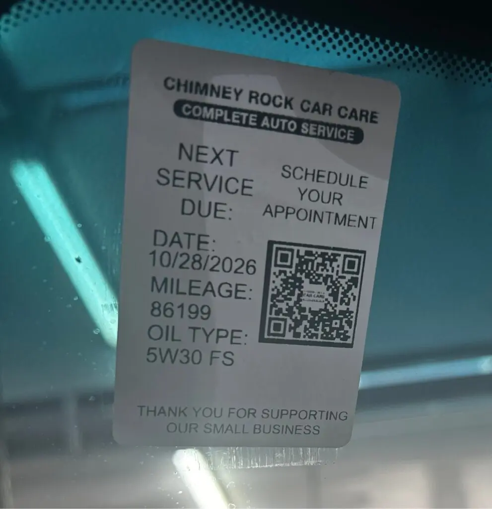 vehicle maintenance reminder sticker at Chimney Rock Car Care in Houston