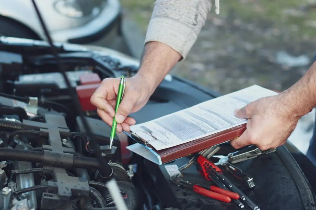 Mechanic repairman checking a car engine.Car service, repair car, repair engine.