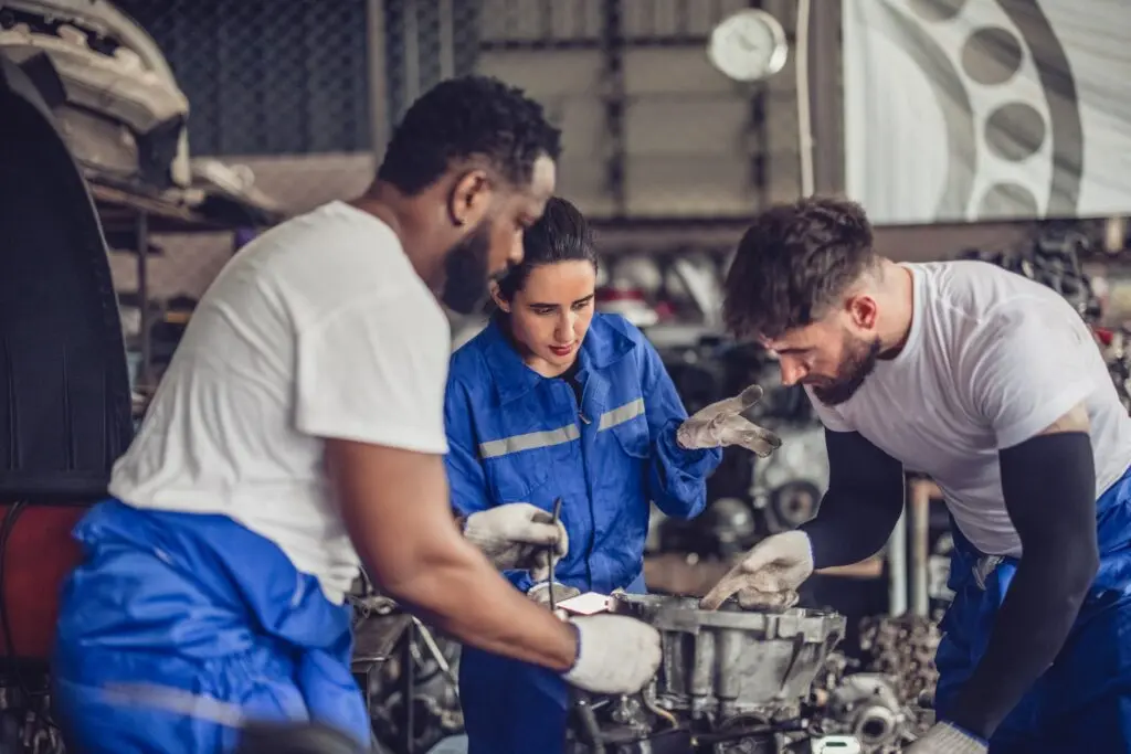 Car technician check engines, choose quality gear for precise repairs to ensure optimal performance