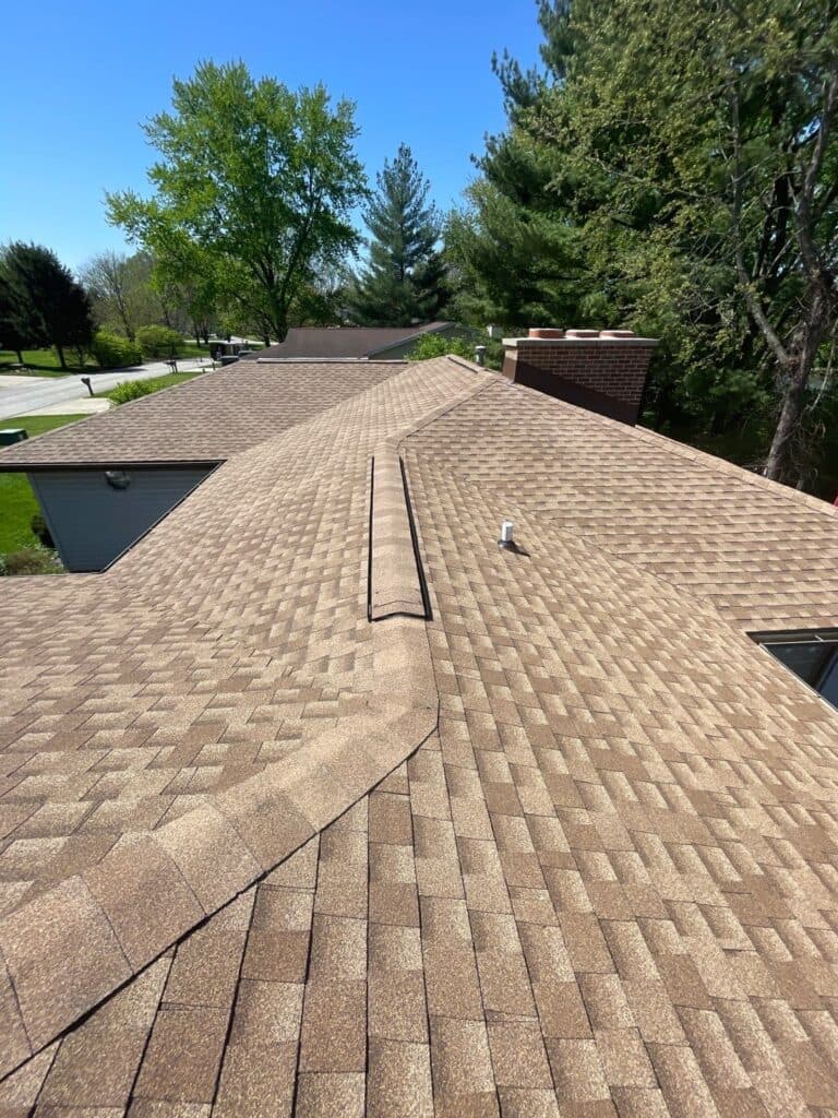 On-roof photo of a roof installed by Sutton’s in Springfield IL showing shingles and professional installation quality