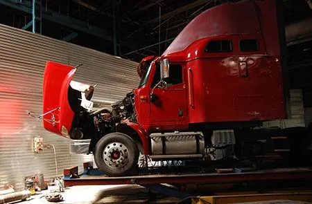 a red truck with the hood open