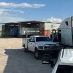 a truck and truck parked in a parking lot