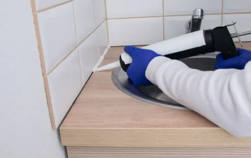 Bathroom countertop recaulking services from Tucson Tile and Grout