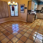 Saltillo tile kitchen floor after grout color sealing in Tucson, AZ home