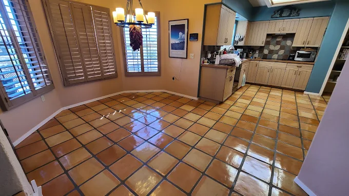 Saltillo tile kitchen floor after grout color sealing in Tucson, AZ home