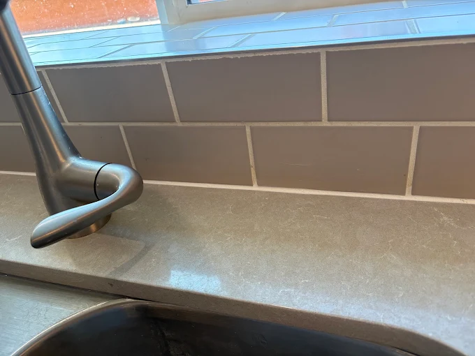 Kitchen backsplash grout sealing to prevent mold and moisture damage in Tucson