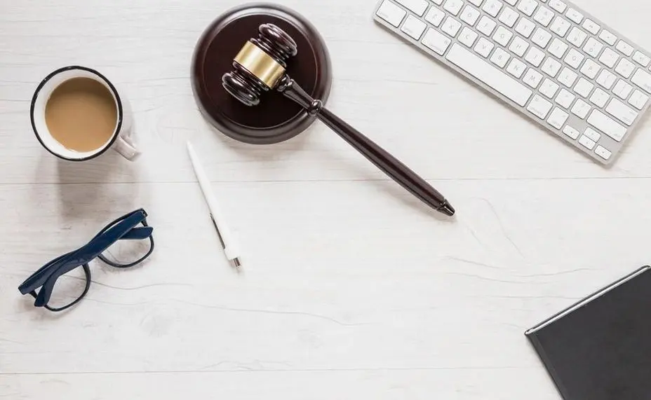 Gavel Keyboard Cup of Tea and Glasses on Table
