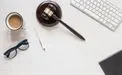 Gavel Keyboard Cup of Tea and Glasses on Table